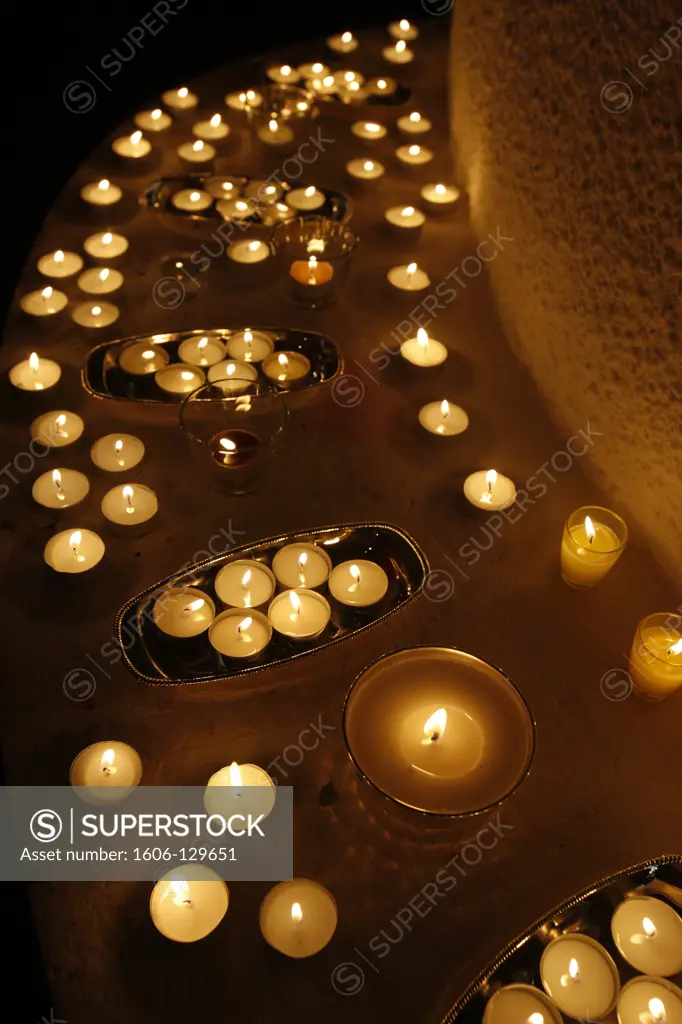 France, Paris. Candle offering for Wesak (Buddha's birthday, awakening & nirvana) celebration at the Great Buddhist Temple (Grande Pagode de Vincennes) France.
