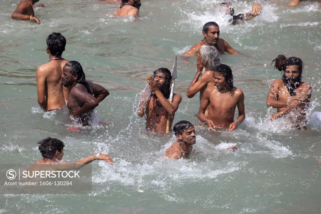 India, Uttarhakand, Haridwar. 'Naga sadhus bathing in the river Ganges on the occasion of ''Somvati Amavasya'', a no moon day in the traditional Hindu calendar. During the Maha Kumbh Mela festival, the  'Shahi Snan' (royal bath) is considered a highly aus