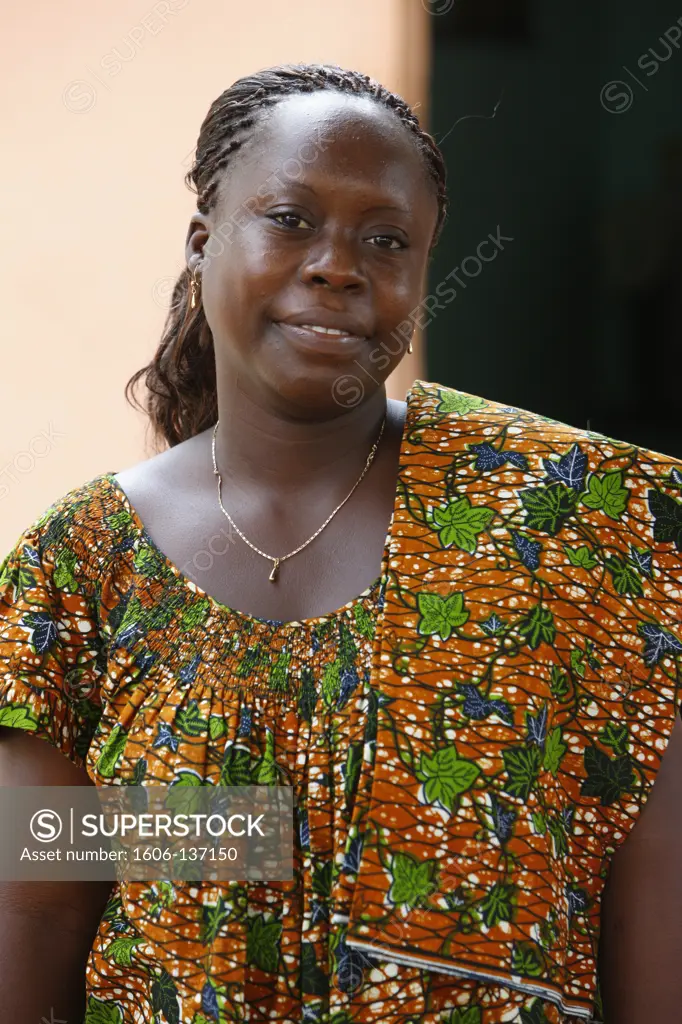 Togo, Lomé. Woman wearing an African dress. Togo.