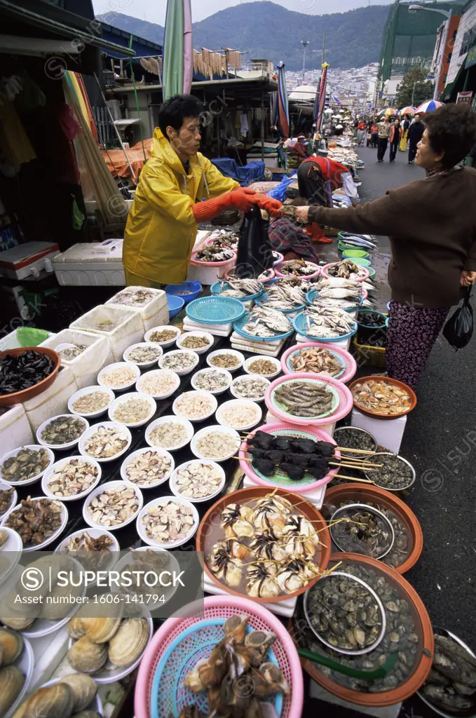 Korea,Busan,Jagalchi Market,Woman Buying Seafood