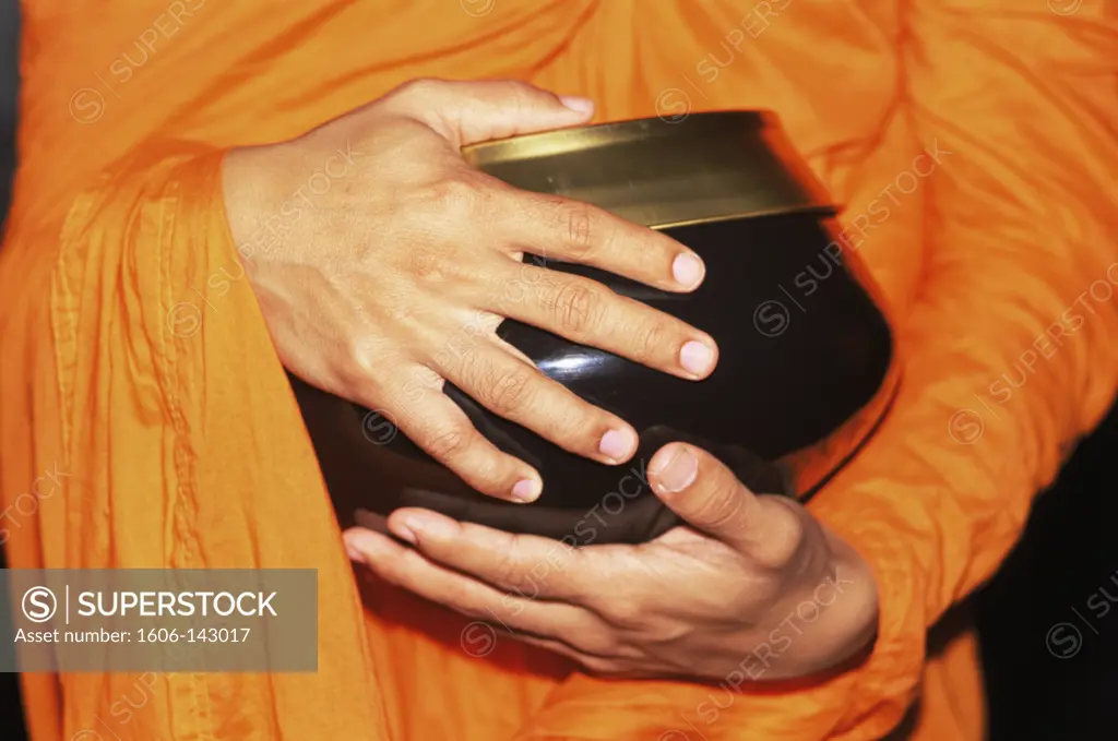 Thailand,Bangkok,Detail of Monk Holding Alms Bowl