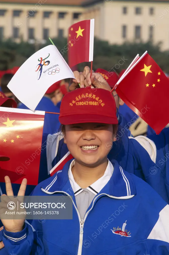 China, Beijing, Tiananmen Square / School Girl with Chinese Flags