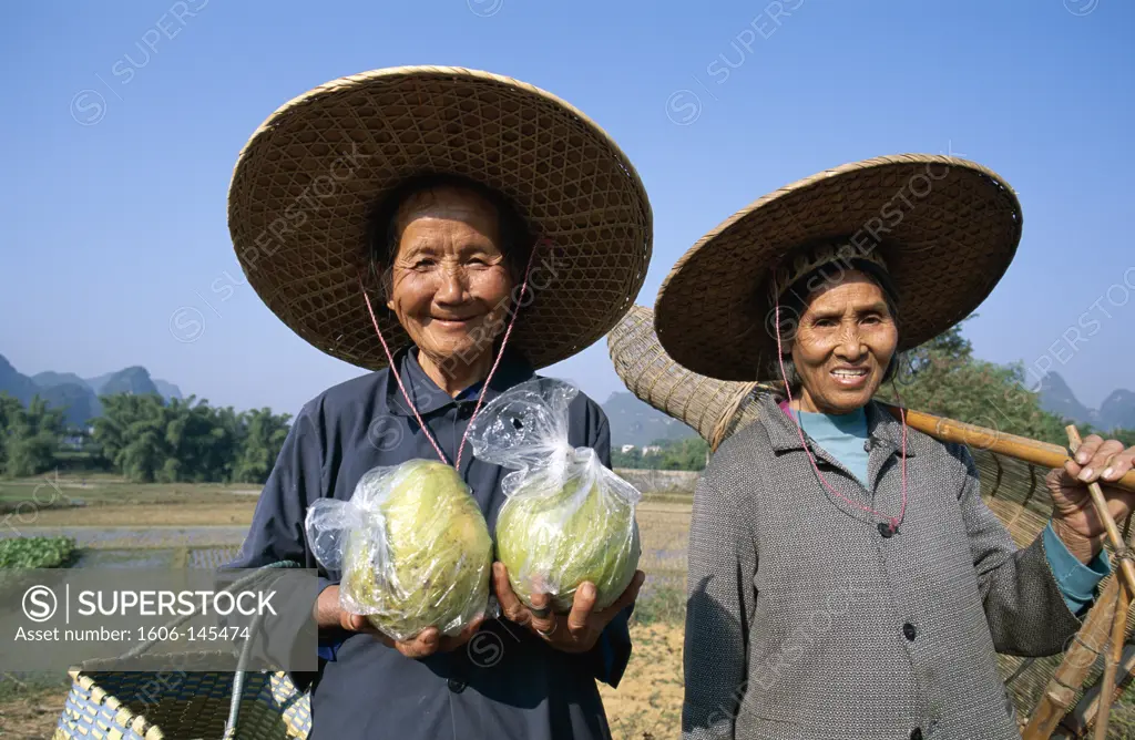 China, Guangxi Province, Guilin / Yangshou, Local Women with Pomelos & Traditional Fishing Basket
