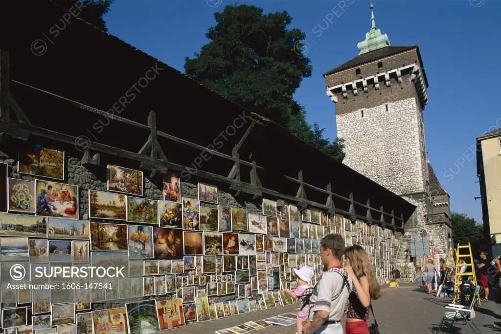 Poland, Cracow (Krakow), The Florian Gate / Couple & Baby Looking at Art