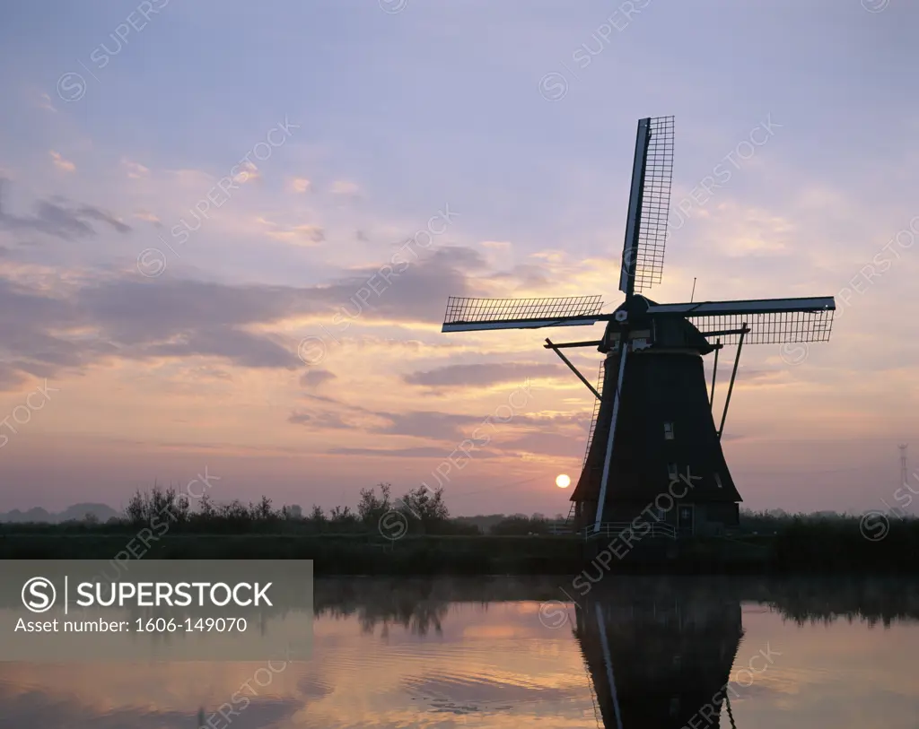 Holland (Netherlands), Kinderdijk, Windmills at Sunset / Silouhette
