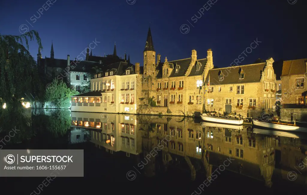 Belgium, Bruges, canal scene at night,