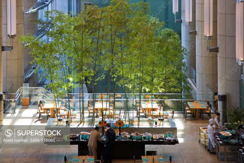 The spacious sunny atrium of the Mandarin Oriental Tokyo Hotel has a bamboo garden in its Italian restaurant, creating a wonderful international mixture inside the Nihonbashi Mitsui Tower, located in the Nihonbashi district of central Tokyo, Japan.