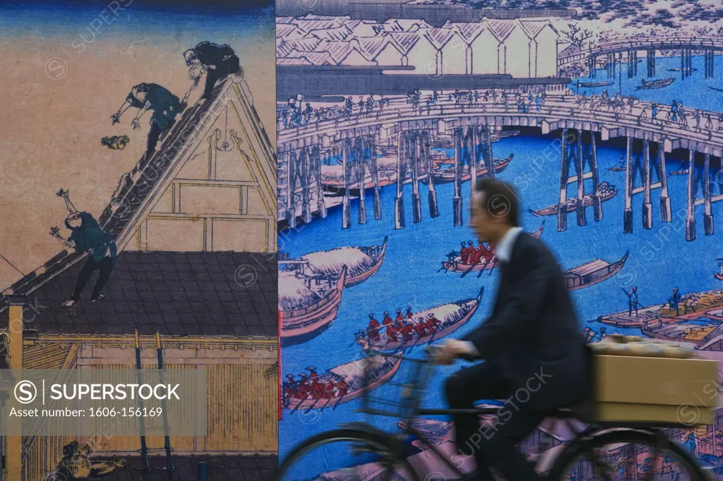 Enlarged woodblock prints from 1833 with Nihonbashi Bridge serve to protect a construction site in the Nihonbashi District of central Tokyo, Japan.