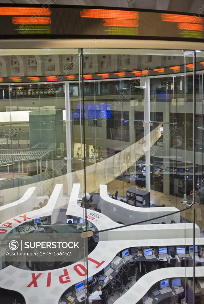 An interior wide-angle view of the completely refitted main trading floor reveals new high-tech automated design replacing the old scenes of frenzied haggling traders, with the TOPIX Index (Tokyo Stock Price Index) results revolving continuously ove ...