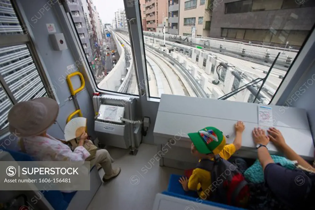 A little Japanese boy rides the first car with his family on the the new Nippori-Toneri Liner elevated train, an AGT (Automated Guideway Transit) line that serves the northeast of Tokyo, Japan.