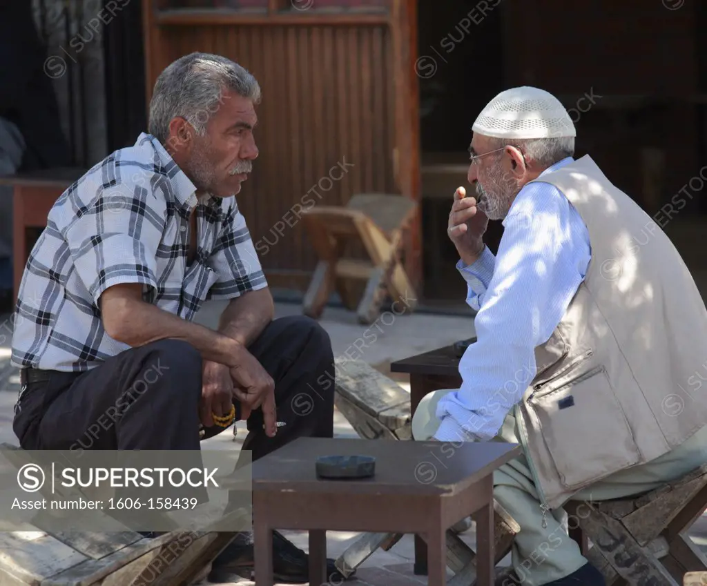Turkey, Sanliurfa, two old men talking,