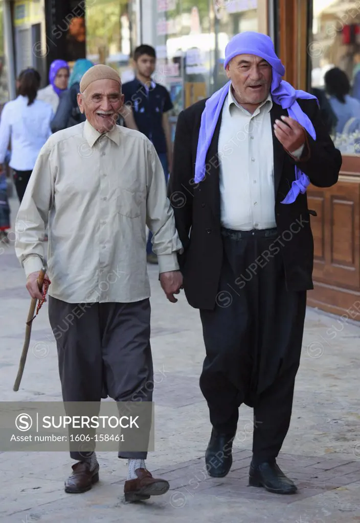 Turkey, Sanliurfa, two old men walking,