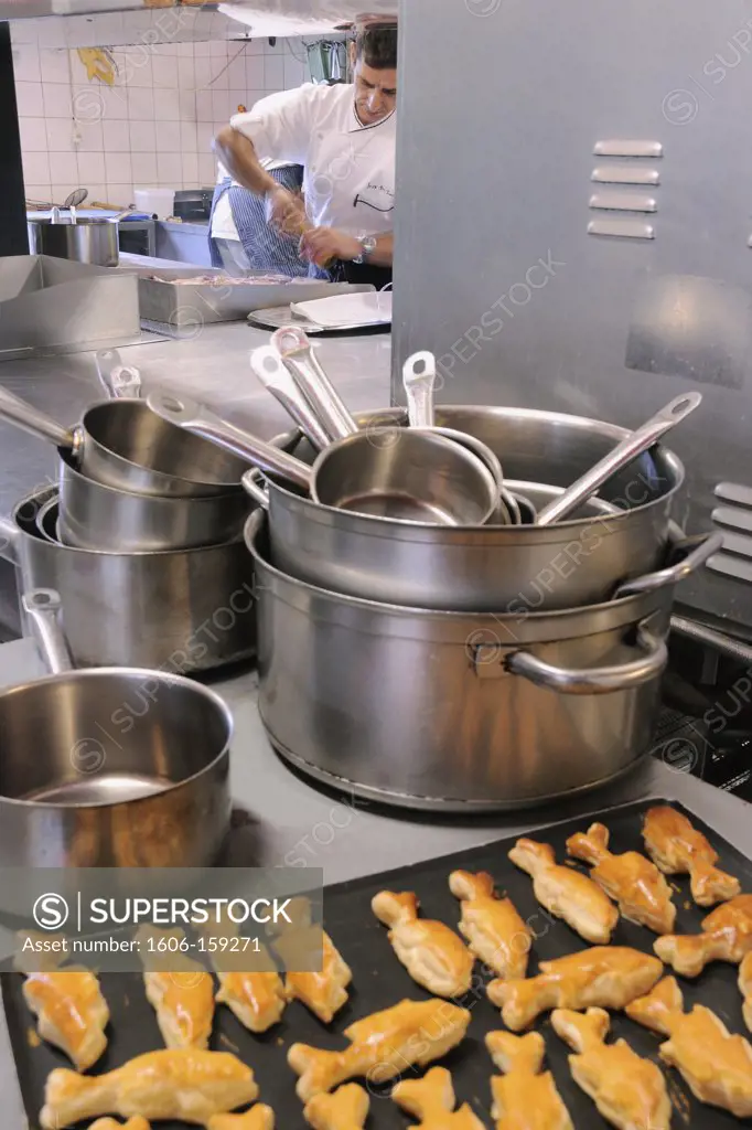 France, 68, Cook peppering chops in restaurant Faudé à L