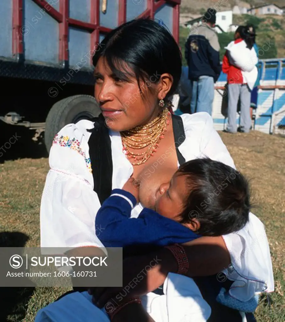Ecuador, Otavalo, Indian mother and child, breast feeding,