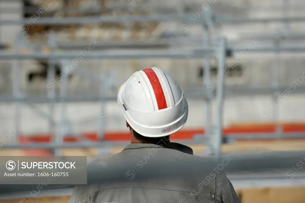 Construction worker wearing a protective helmet