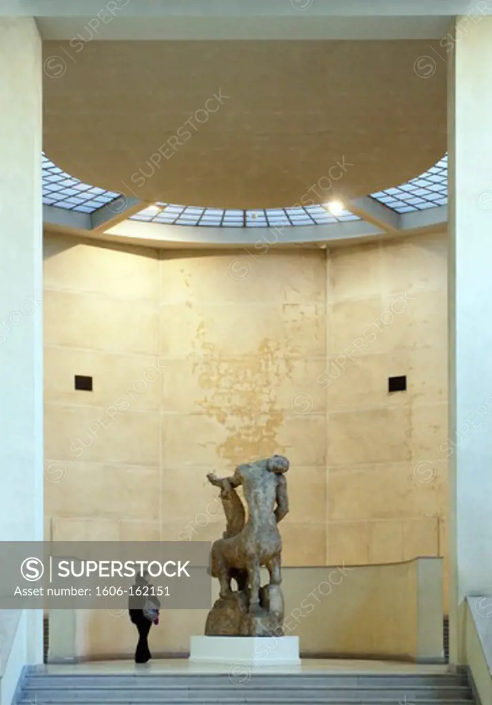 France,Paris,14th, Bourdelle Museum, la Salle of plaster, visitor looking the sculpture ""Centaure mourant""