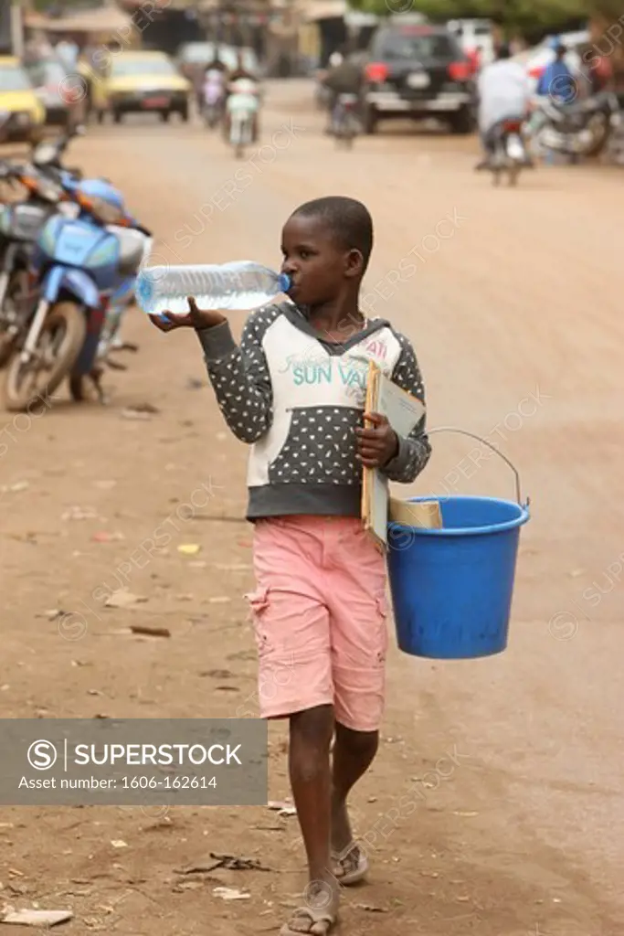 African girl drinking water. Bamako. Mali. (Bamako, Mali)