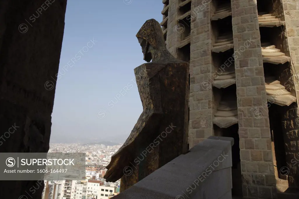 The Temple of the Sagrada Familia - Ascension of Christ sculpture over the city . Barcelona. Spain.