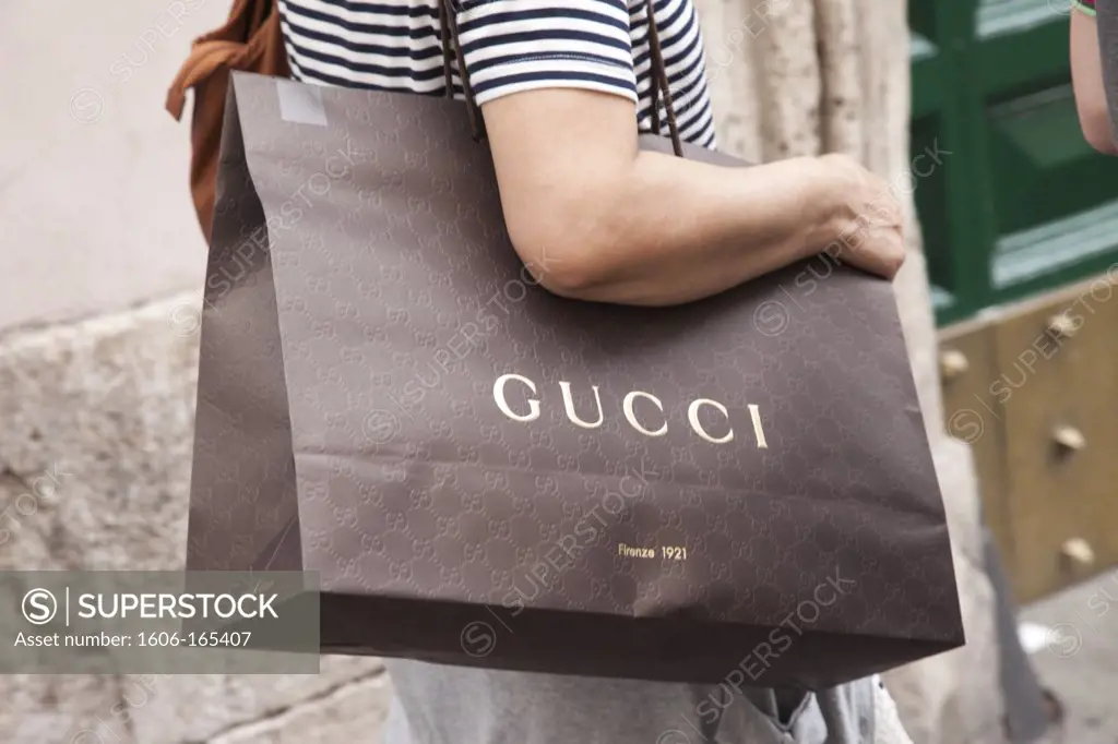 Italy,Rome,Via Dei Condotti,Street Scene,Woman Holding Gucci Shopping Bag