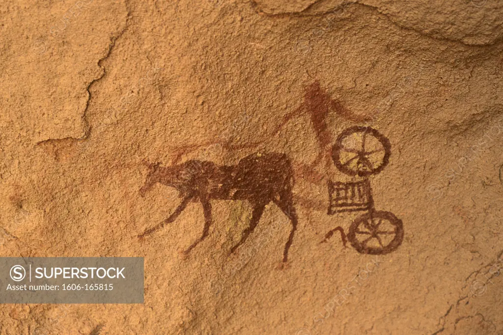 Libya Acacus plateau, close-up of rock painting representing a man on chariot