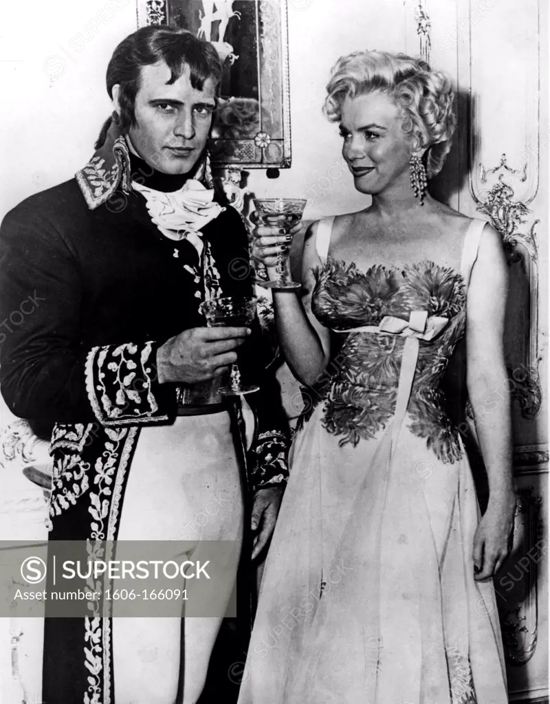 On the set, Marlon Brando plays Napoleon Bonaparte in the movie ""Desirée"" directed by Henry Koster and Marilyn Monroe in ""There's No Business Like Show Business"" directed by Walter Lang 20th Century Fox