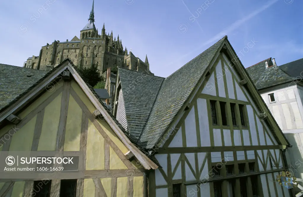 France, Normandy, Manche, Mont-Saint-Michel, timber framed houses, abbey in background