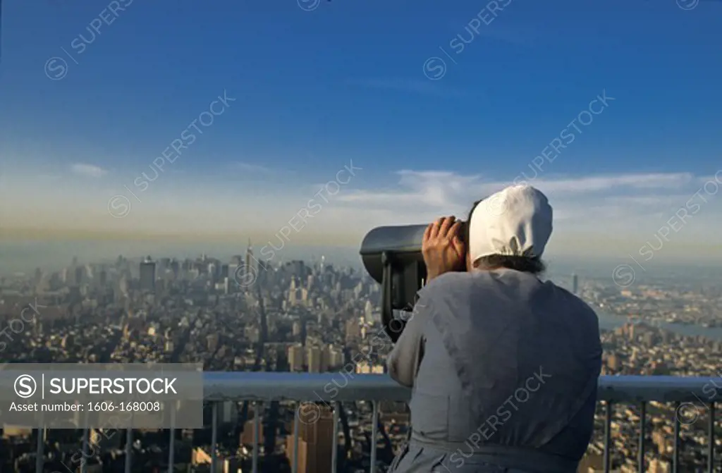 New York - United States, Amish woman gazing the view of the city from the terrace - the top of the world - on the World Trade Center tower
