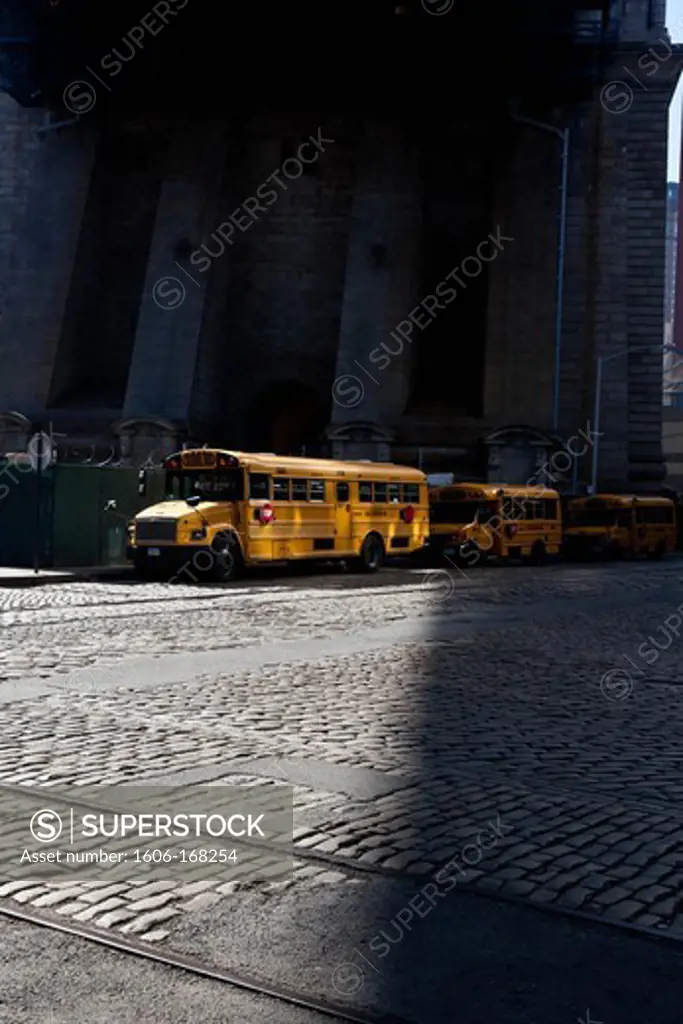 New York - United States, school bus in Dumbo area, under the Brooklyn and Manhattan bridges