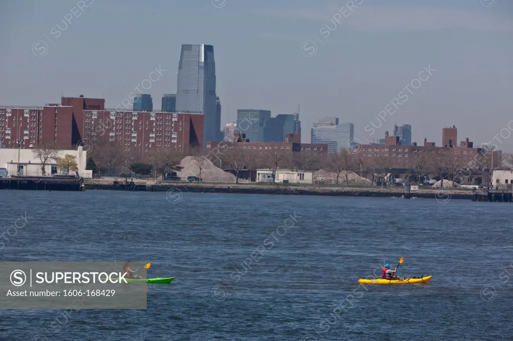 New York - United States, people kayaking in Red Hook, at Coffey pier Brooklyn, the old docks are becoming a trendy area