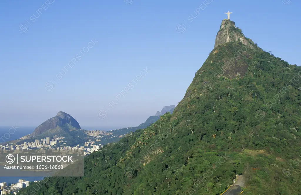 Brazil, Rio de Janeiro, Corcovado, statue in the foreground, Two Brothers Hills at the back, sea, blue sky