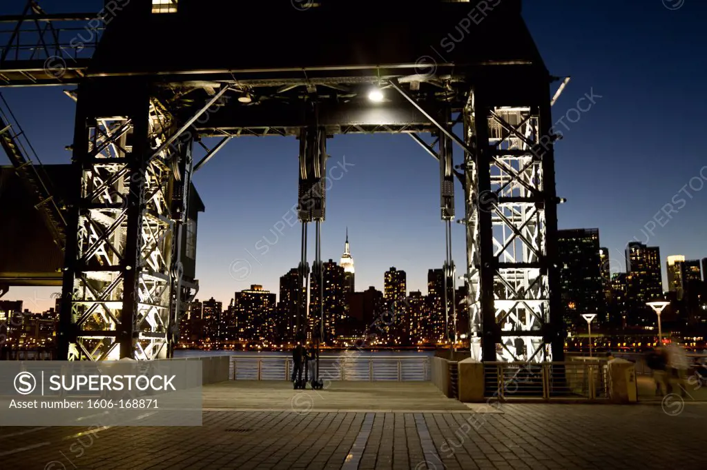 New York - United States, old industrial docks, Manhattan Skyline and renovated gantries view from Long island city, new real estate project in Queens, at night