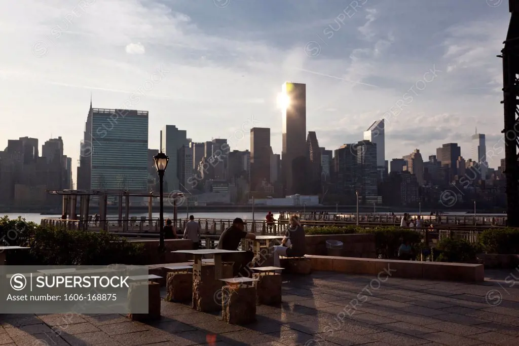 New York - United States, people watching the sunset, old industrial docks, Long island renovated gantries, Manhattan Skyline