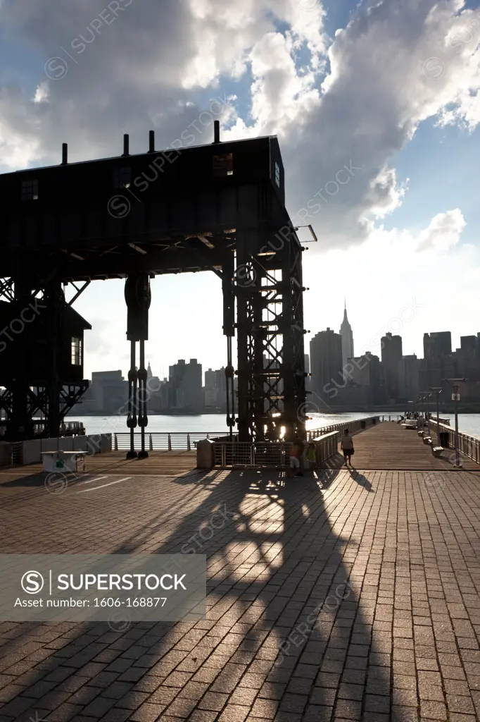 New York - United States, old industrial docks, Long island renovated gantries, Manhattan Skyline, sunset