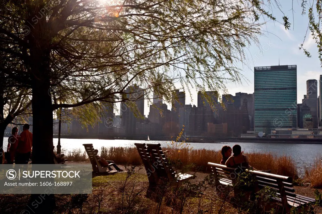 New York - United States, people gazing the view of Midtown Manhattan skyline from Gantry Plaza State park in Long island city, on the former Pepsi cola factory, Queens