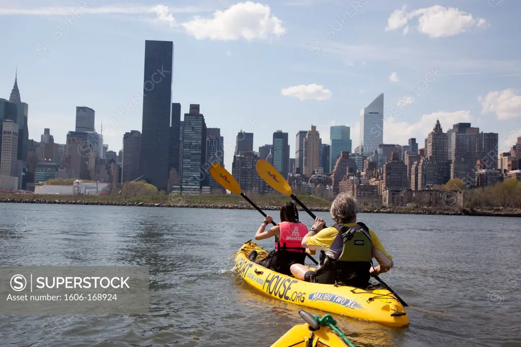 New York - United States, kayaking on the East river in front of the skyline of Midtown
