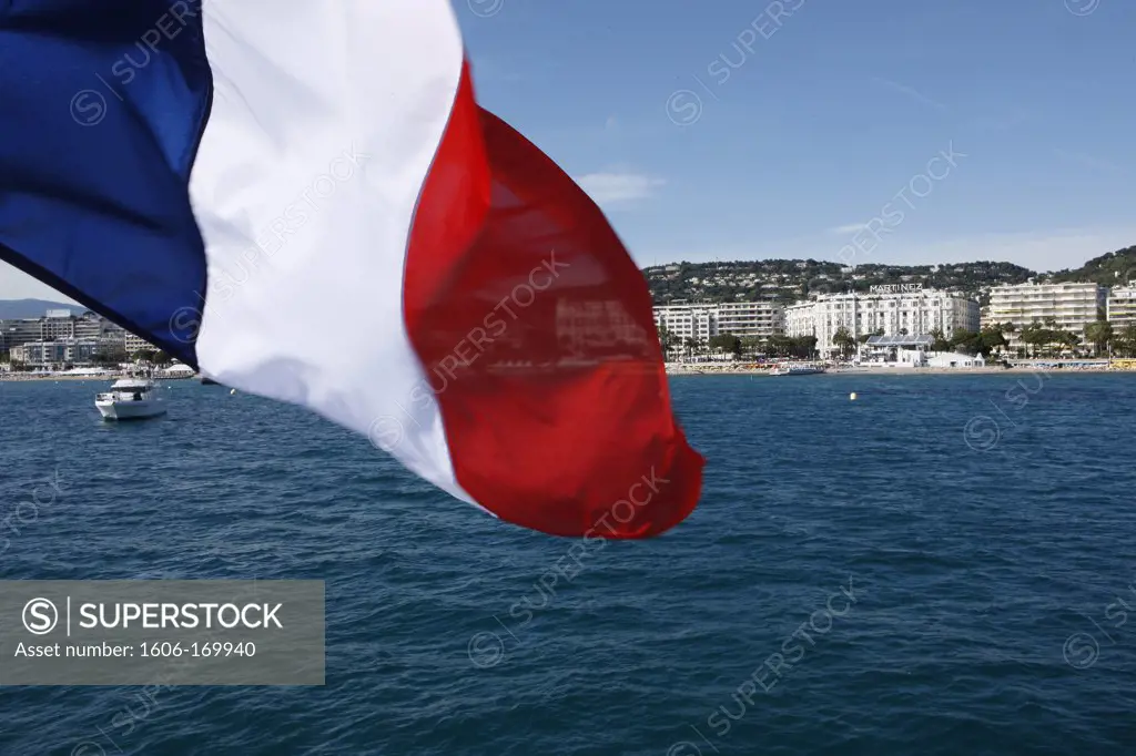 Bay of Cannes and a French flag