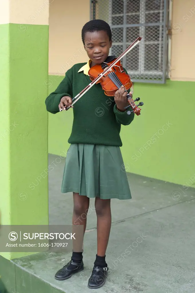 South Africa, Cape Town, Township of Nyanga, primary school, young girl playing with a violin