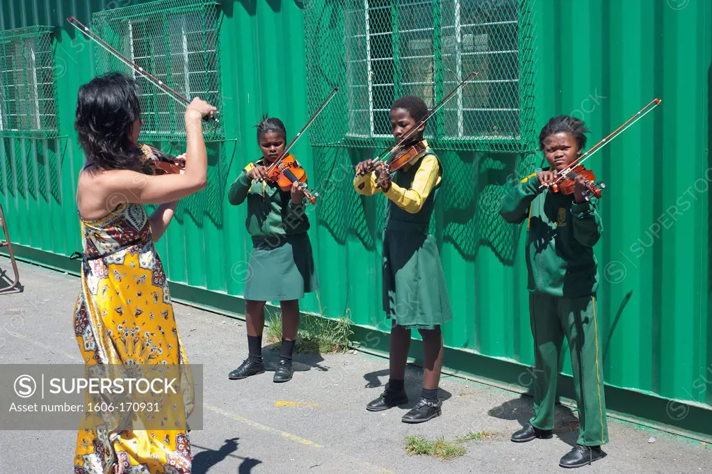 South Africa, Cape Town, Township of Nyanga, Primary school, students playing violin