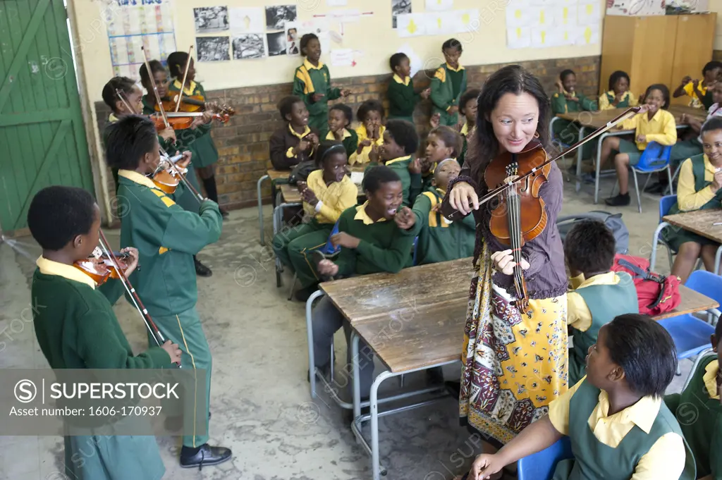 South Africa, Cape Town, Township of Nyanga, Primary school, students playing violin