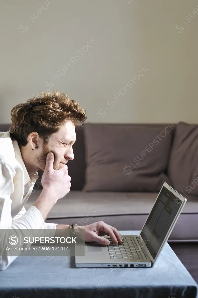 Man using a laptop at home
