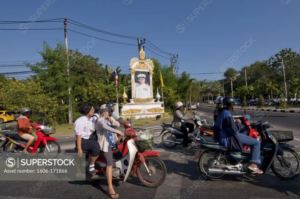 Asia, Thailand, Phuket, motorbike traffic with portrait of king Bhumibol Adulyadej
