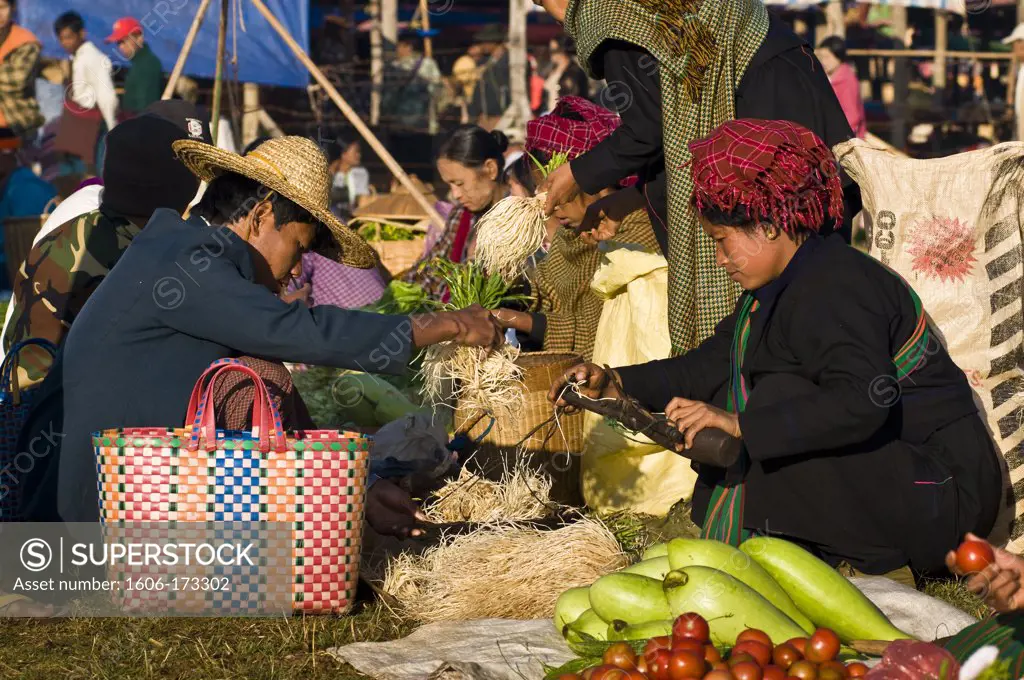 Myanmar (Burma), Shan State, Inle Lake, village of Nam Hu, Paya Paung Daw Oo Pagoda, market, Paho women selling vegetables