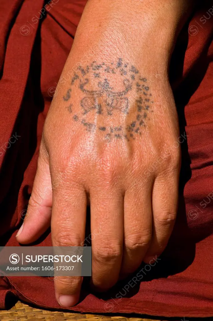 Myanmar (Burma), Shan State, Inle Lake, village of Nam Hu, the Paung Daw Oo Pagoda, Nam Hu monastery, the monk U Khay Mein Da has tatooed garoudas, snakes or spiders on his arms as protective amulets