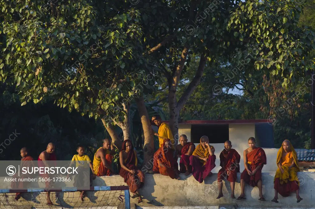 Myanmar (Burma), Mandalay State, Mandalay, bonzes and monks looking at a football match