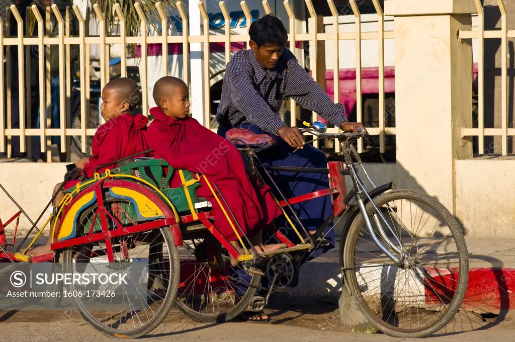 Myanmar (Burma), Mandalay State, Mandalay, the bonzes A Shin Nyan Tika and A Shin Thu Wanna going to school on a rickshaw driven by Ko Aung Naingoo