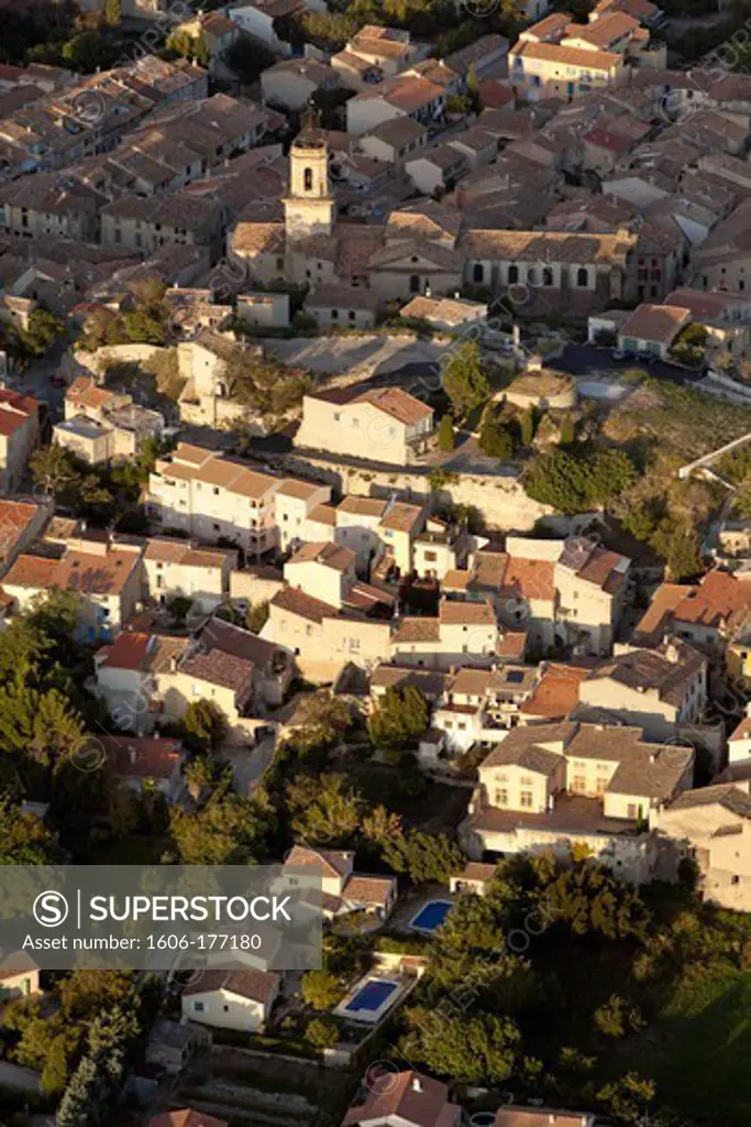France, Bouche-du-Rhone (13), Eyguières, Provencal village of the Baux valley at the foot of the Alpilles, (aerial view),