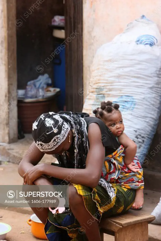 African woman carrying her baby on her back. Lome. Togo.