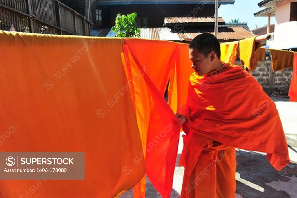 Asia, Southeast Asia, Laos, Luang Prabang, Monk drying his clothes
