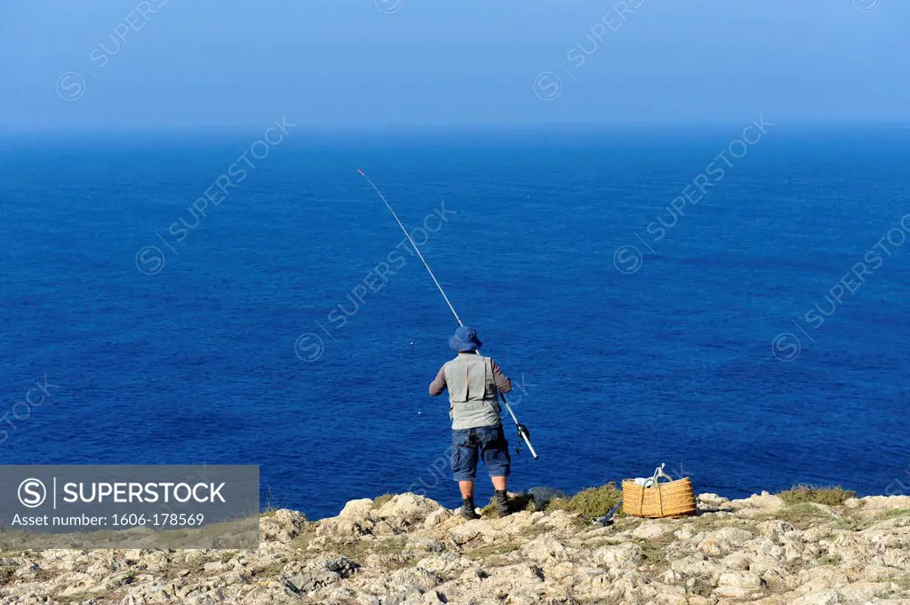 Man fishing near Cabo de Vincente,the Portuguese Coast in Algarve,Portugal,South Europa,Europa