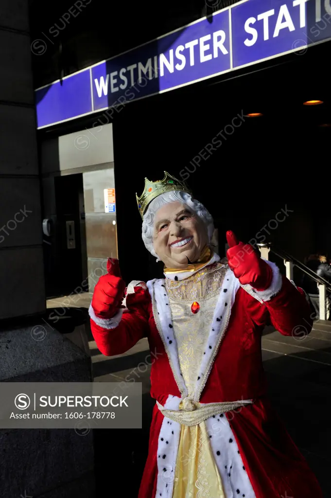 Man wearing a king costume in front of Westminster station in London,England,United Kingdom
